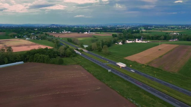 Hyper-lapse of traffic on a highway, aerial panoramic view, US Route 222 in Pennsylvania, car trails in the dusk, non-urban landscape