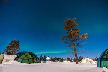 Northern lignt in Finland over Igloo house 