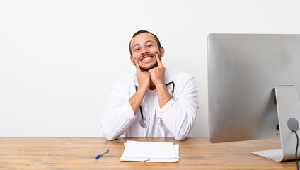 Doctor Colombian man smiling with a happy and pleasant expression