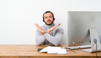 Telemarketer Colombian man making NO gesture