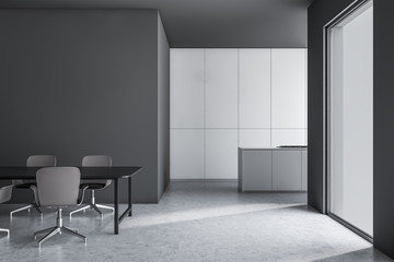 Gray and white kitchen with counter and table