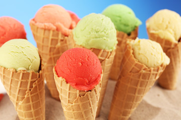 Set of ice cream scoops of different colors and flavours with berries and fruits