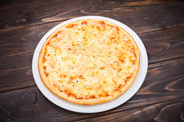 pizza on the wooden background