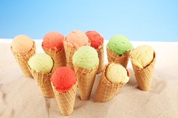 Set of ice cream scoops of different colors and flavours with berries and fruits