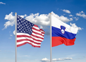 United States of America vs Slovenia. Thick colored silky flags of America and Slovenia. 3D illustration on sky background. - Illustration