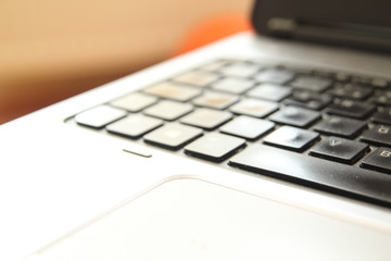 typing on a laptop computer keyboard close up