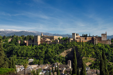 Fototapeta na wymiar Albaicin rooftops with Alhambra Nasrid Palaces and Alcazaba fortress Sierra Nevada Mountains Granada