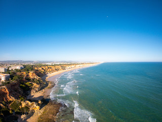 Algarve, Portugal aerial view on beach and coast of Atlantic Ocean. Hotels zone on Cliffs in Praia de Falesia Albufeira 