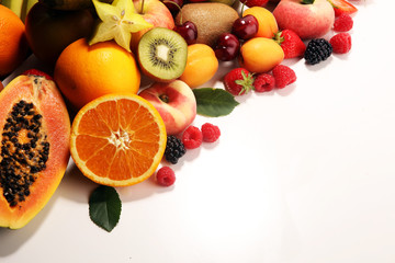 Fresh summer fruits with apple, peach, papaya, berries, pear and apricot.