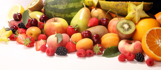 Fototapeta na wymiar Fresh summer fruits with apple, peach, papaya, berries, pear and apricot.