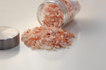 Fototapeta na wymiar Himalayan salt in glass jar on white table