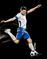 one caucasian soccer player man isolated on black background with light painting speed effect
