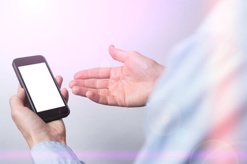 Mockup image of hand holding mobile phone with blank screen in color background