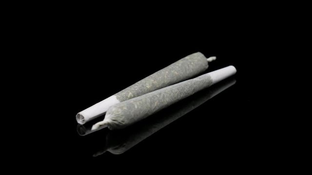 Spinning Pair of Rolled Up Marijuana Joints Loopable