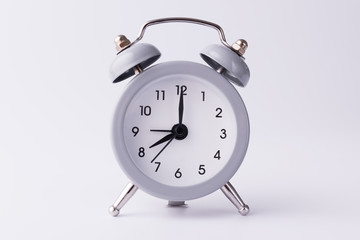 clock with alarm clock stand on a white background and show the exact time with arrows