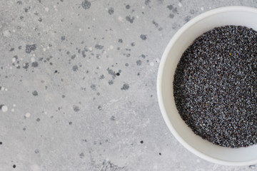 Pastry poppy in a white plate on a light background
