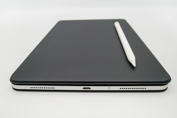 smart and moden tablet with smart pen and black cover color that isolated on white background
