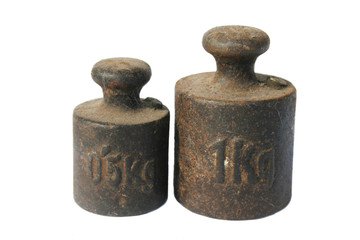 Half kg and 1 kg weights for retro scales at the white background