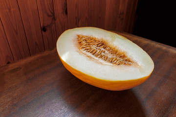 cut melon on a wooden background