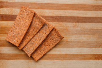 gluten-free breads cookies on a wooden kitchen cutting board. Homemade Gluten Free vegan bread.