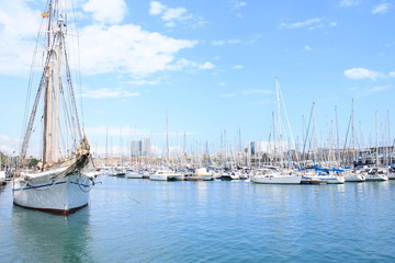 Fototapeta premium Sail boat in Marina Port Vell, a waterfront harbor in Barcelona, Catalonia, Spain