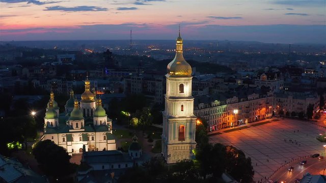 Aerial view of the St. Sophia Cathedral, illuminated at night, the monument to Bogdan Khmelnitsky and the center of Kiev