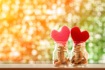 Keep a gold coin in the two clear bottle with growing value as a red and pink hearts on the top on...