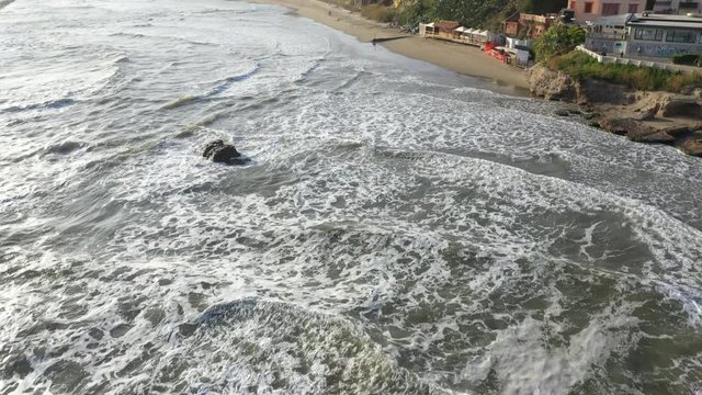 Aerial view of the free beach of the Nerone caves next to the Imperial Villa of Anzio in Italy. Here are the ruins of the emperor's villa of ancient Rome.