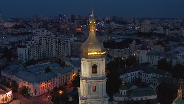 Aerial view of the St. Sophia Cathedral, illuminated at night, the monument to Bogdan Khmelnitsky and the center of Kiev