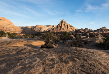 Pectols Pyramid is a prominent rock formation that is located with in Capital Reef National Park, Utah. Late afternoon light and shadows add to the dramatic landscape of the Utah desert.