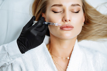 Injections of the lips. Correction form the upper lip. Injection of beauty. Spa. Facial...
