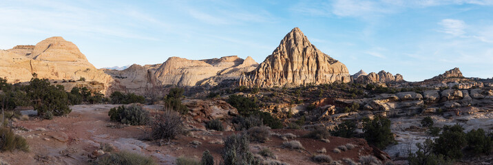 Pectols Pyramid is a prominent rock formation that is located with in Capital Reef National Park, Utah. Late afternoon light and shadows add to the dramatic landscape of the Utah desert.
