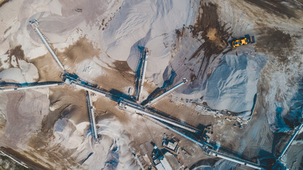 Aerial view of the granite - gravel pit. Equipment for processing and crushing stones