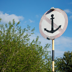 Closeup of a special sign for ships on the background of trees. Parking in this place is...