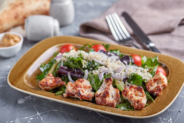 Chicken Salad. Chicken Caesar Salad. Caesar Salad with grilled chicken on plate. Grilled chicken breasts and fresh salad in plate