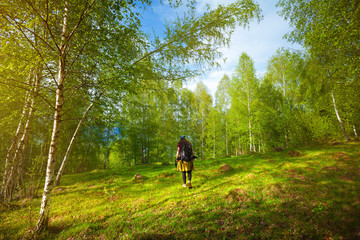 Girl travelling through beautiful epic mountain landscape