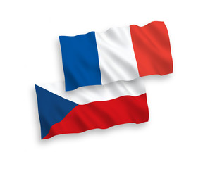National vector fabric wave flags of France and Czech Republic isolated on white background. 1 to 2 proportion.