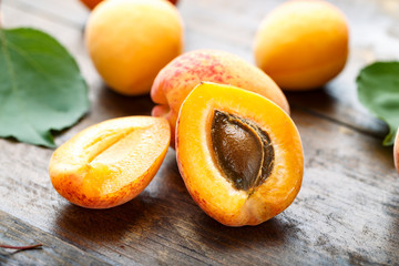 Ripe apricots and apricot leaves