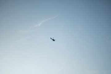 Helicopter overhead in the sky