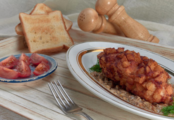 Delicious fried Patty of chicken meat, Pozharskaya.With creamy mushroom sauce.Fresh vegetable salad.Fried toast.