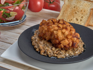 Delicious fried Patty of chicken meat, Pozharskaya.With creamy mushroom sauce.Fresh vegetable salad.Fried toast.