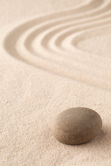 Fototapeta premium Sand and stone texture background with line pattern. Minimal zen meditation garden. Concept for yoga, spa wellness or buddhism and mindfulness. With copy space..