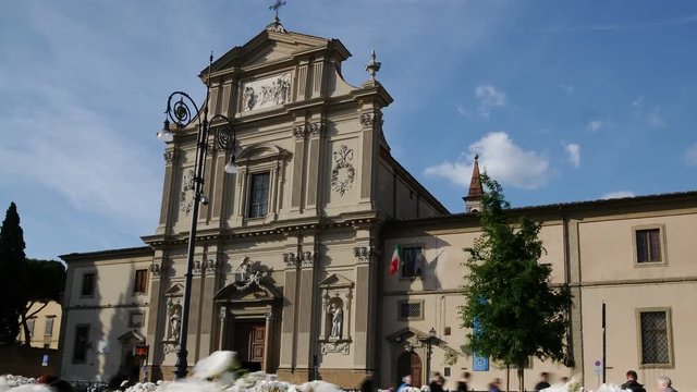 Time-lapse of Church of San Marco with beautiful white roses on foreground in Florence, Italy. Time-lapse 4K UHD Video.