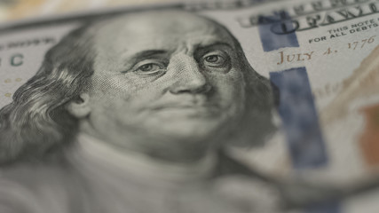 Portrait of Benjamin Franklin on dollar banknote, financial crisis and inflation