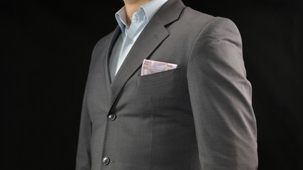 Euros in businessman suit pocket, money saving, income and successful startup