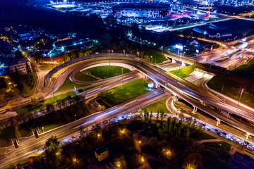 Fototapeta na wymiar Night Aerial view of a freeway intersection traffic trails in night Moscow