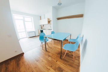 modern light interior. room with white walls and wooden floor.
