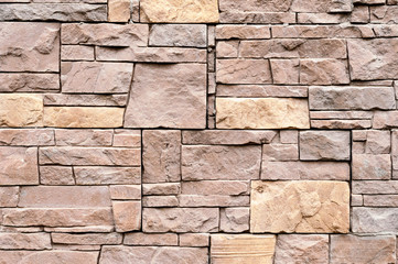brown brick texture background with stones, brick wall