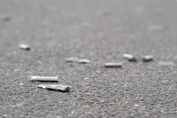 Butts on the street on asphalt