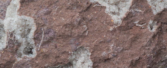 macro texture abstract background of dark red mineral stone surface